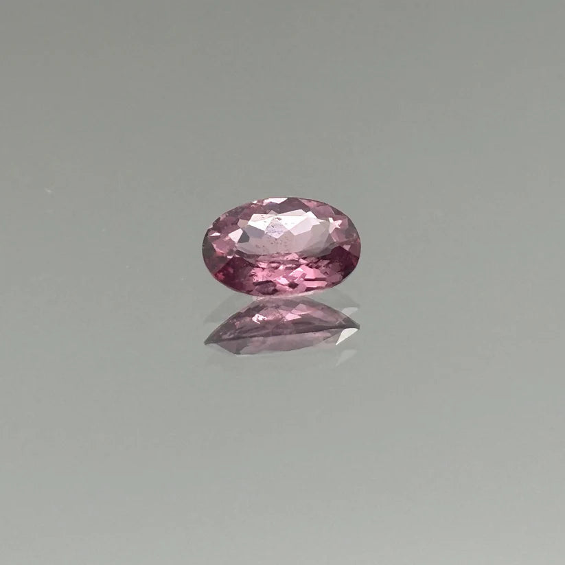 A Ceylon spinel resting on a pale stage